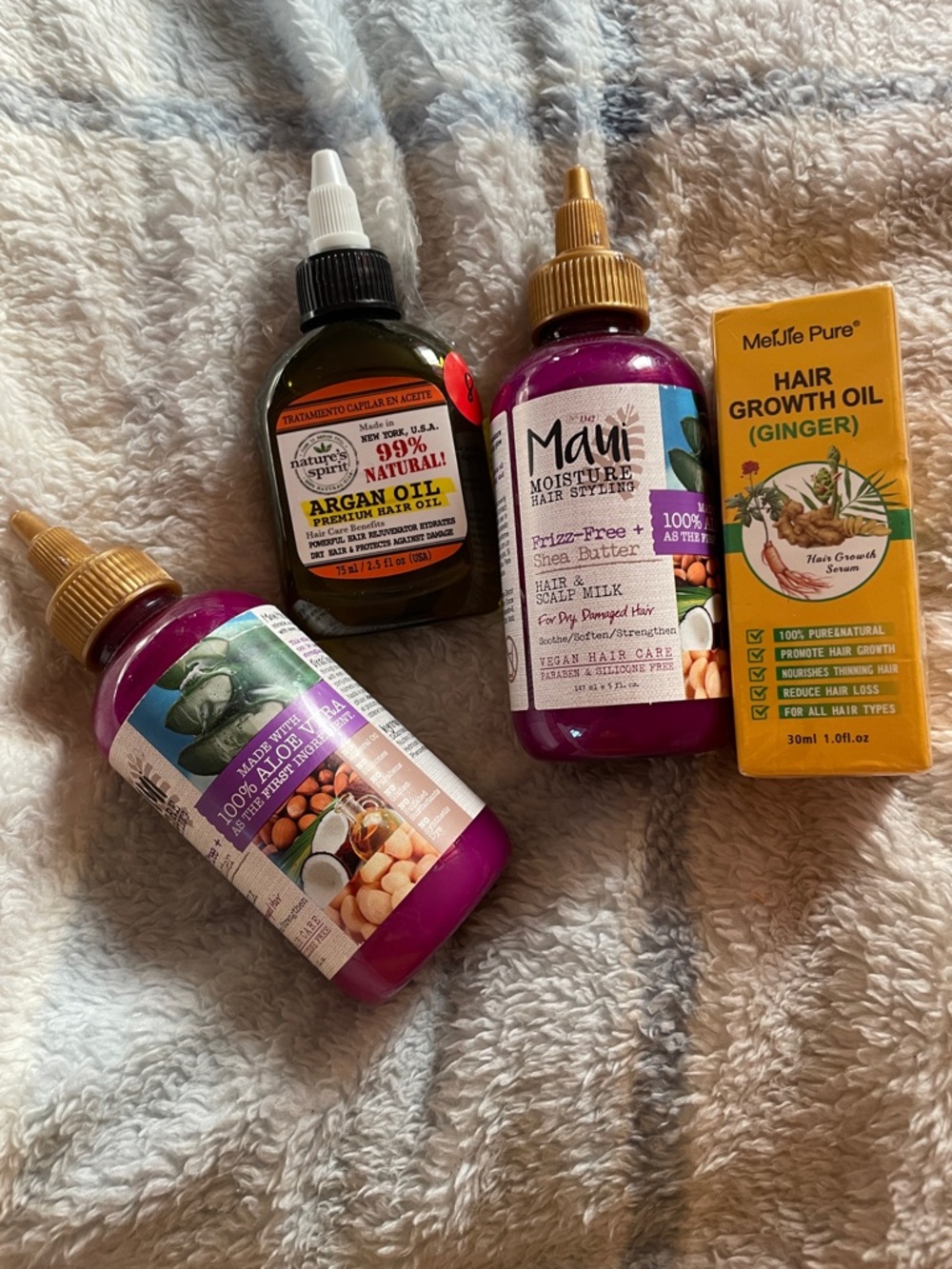 Maui hair milk-2, argan oil by natures spirit, and Meijie Pure ginger hair growt